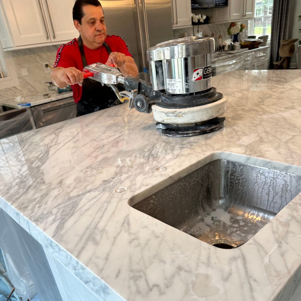 Stone care expert polishing marble surface