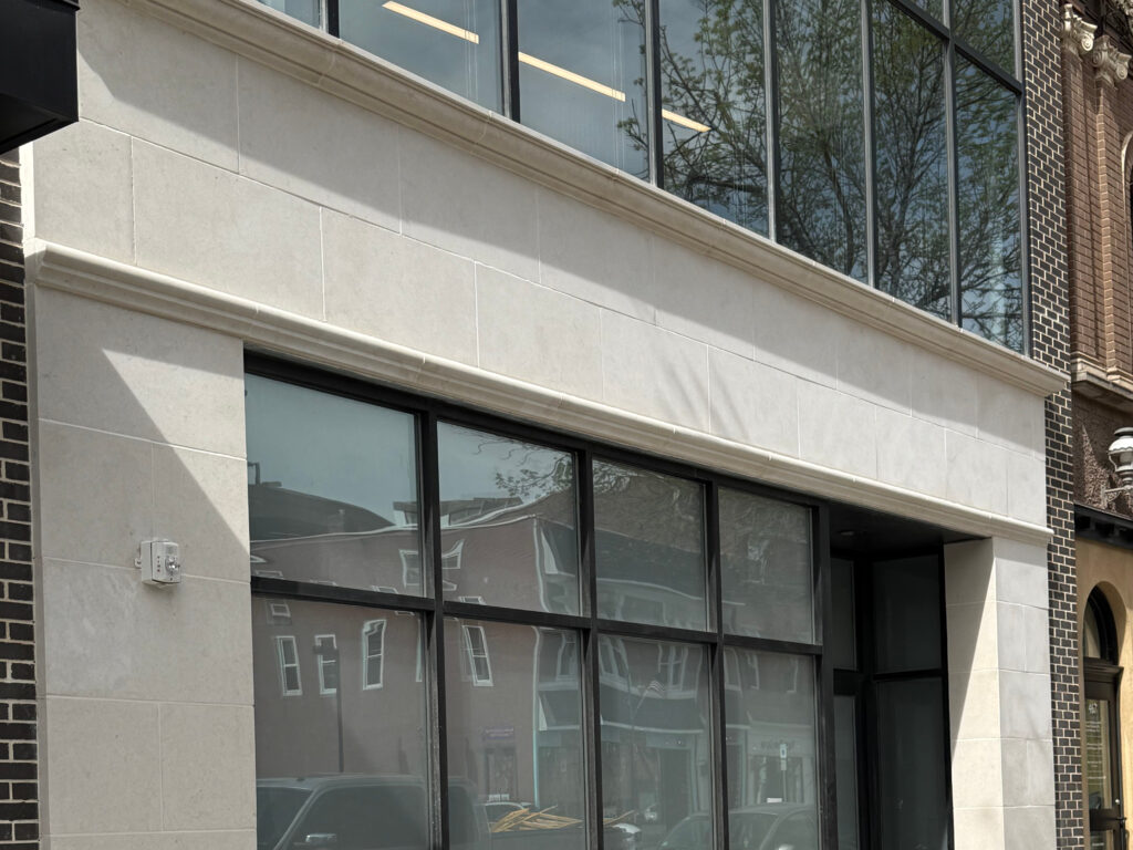 Recently repaired limestone storefront of a local business.