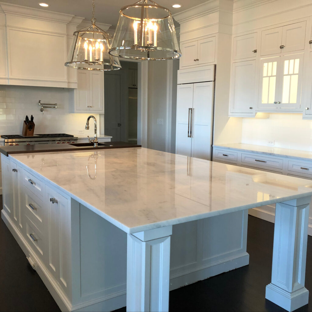A white marble kitchen countertop cleaned and polished.