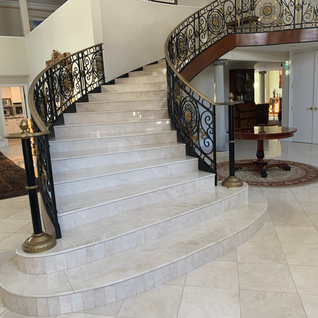A white marble staircase built by Sealstone Services